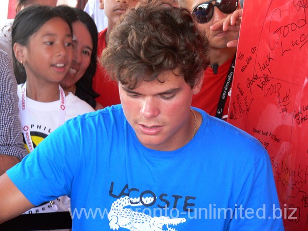 Milos Raonic is surounded by fans at Rogers Cup 2012.