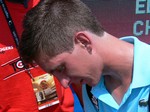 Filip Peliwo signing autographs after the match with Ivan Dodig.