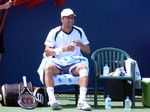 Marco Chiudinelli on tennis court. 