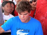 Milos Raonic is surounded by fans at Rogers Cup 2012.