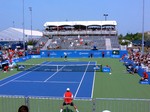 Filip Peliwo is serving on Granstand Stadium in qualifying match with Ivan Dodig  