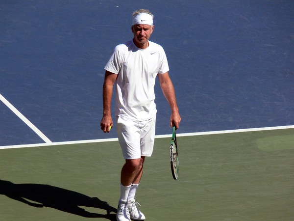 John McEnroe on Centre Court during exhibition game, before his serve. August 11, 2013 Rogers Cup Toronto