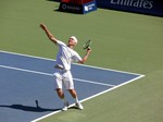 Beatiful serving motion of John McEnroe. He is playing an exhibition game with Jim Courier August 11, 2013 Rogers Cup Toronto