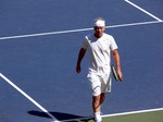 John McEnroe walking on Centre Court, playing exhibition game with Jim Courier August 11, 2013 Rogers Cup Toronto