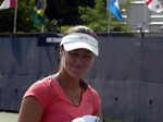 Martina Hingis with forced smile on the practice court August 8, 2013 Rogers Cup Toronto