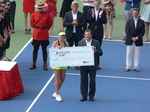 Belinda Bencic presented with a Champion�s cheque for $490,200 US by Ghislain Parent � Chief Financial Officer of National Bank 16 August 2015 Rogers Cup Toronto.