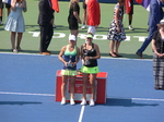 Belinda Bencic and Simona Halep are holding and displaying their trophies on Centre Court after the singles final 16 August 2015 Rogers Cup Toronto