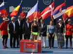 Belinda Bencic with Trophy standing with Karl Hale, Allan Horn, Ghislain Parent, Mike Tevlin, Giulia Orlandi and Wanda Restivo on Centre Court 16 August 2015 Rogers Cup Toronto. 