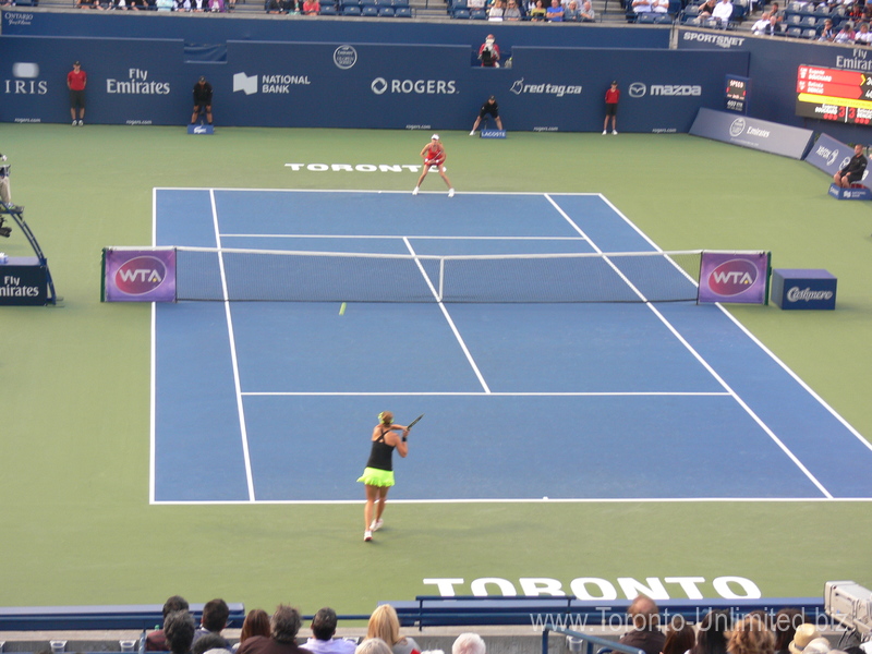 Belinda Bencic and Eugenie Bouchard in rallies on Centre Court 11 August 2015 Rogers Cup Toronto