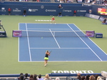 Belinda Bencic and Eugenie Bouchard in rallies on Centre Court 11 August 2015 Rogers Cup Toronto