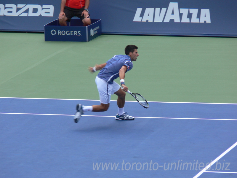 Novak Djokovic (SRB) is vollying near the Net on Centre Court in singles final 31 July 2016 Rogers Cup in Toronto  