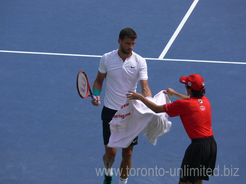 Grigor Dimitrov (BUL) is taking a towel during match against Kei Nishikori (JPN) 29 July 2016 Rogers Cup in Toronto