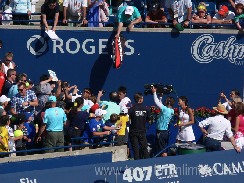 Kei Nishikori is signing autographs to his fans after the semifinal win over Stan Wawrinka (SUI)  30 July 2016 Rogers Cup in Toronto