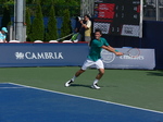 Bernard Tomic (AUS) returning the serve on Granstand 25 July 2016 Rogers Cup Toronto 