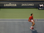 Milos Raonic is at the Net volleying Gael Monfils on Central Court 29 July 2016 Rogers Cup Toronto