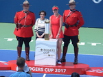 Elina Svitolina with Trophy and Helena Leong and RCMP Honor Guards.