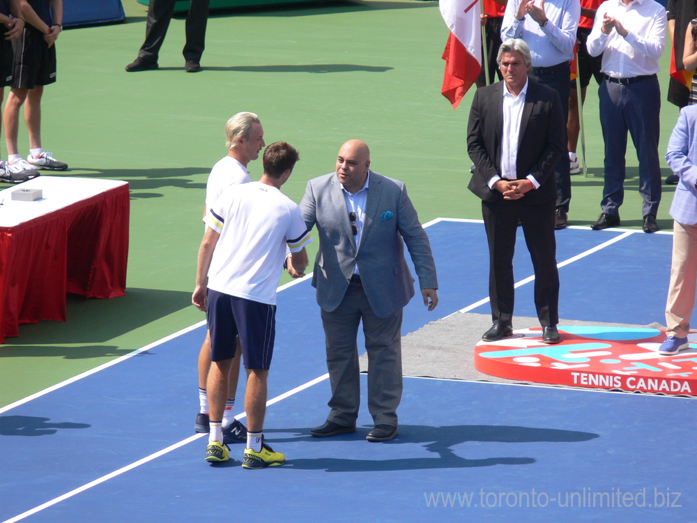 Doubles Champions Henri Kontinen and John Peers are receiving winner cheque from Tarek Naguib of National Bank. Rogers Cup August 12, 2018 Toronto.