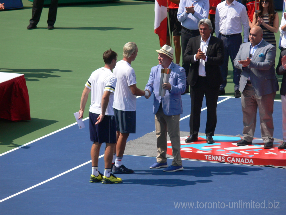 Doubles Champions Henri Kontinen and John Peers are receiving Trophy from Scott Moore of Sports Net.