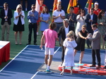 Stefanos Tsitsipas about to receive Runners Up Trophy from Louis Vachon.