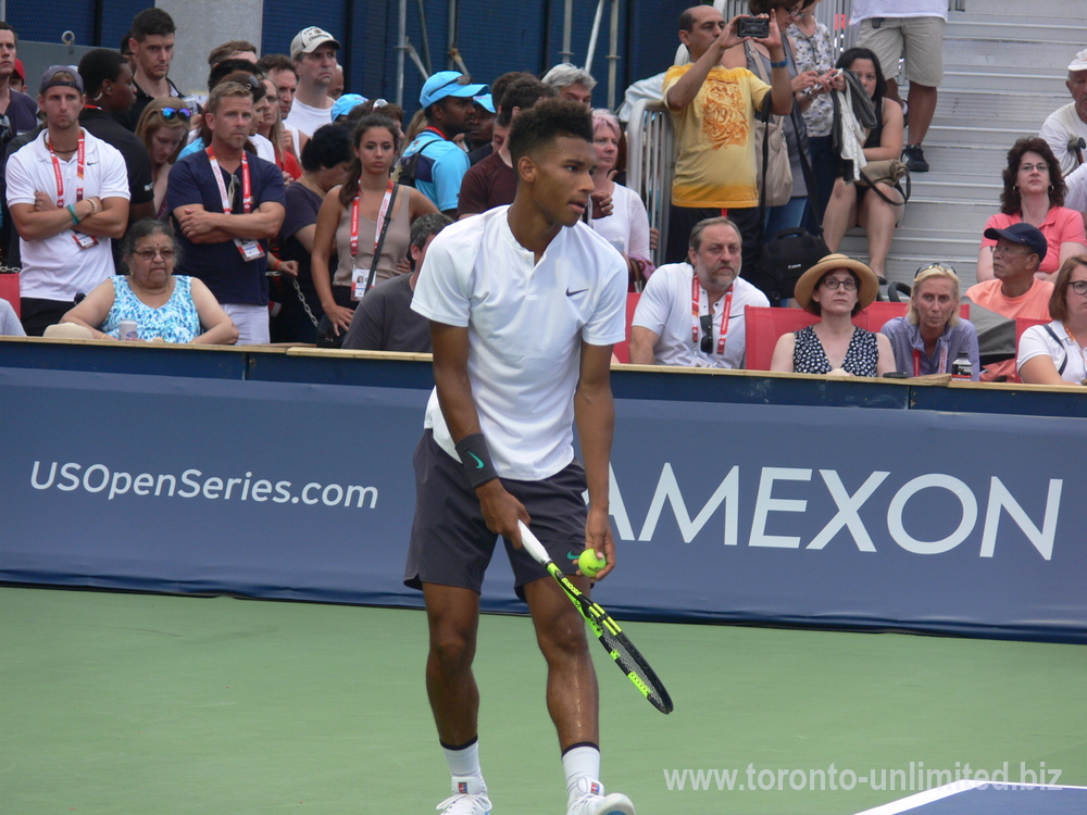 Felix Auger-Aliassime about to serve in the doubles match August 6, 2018 Rogers Cup Toronto