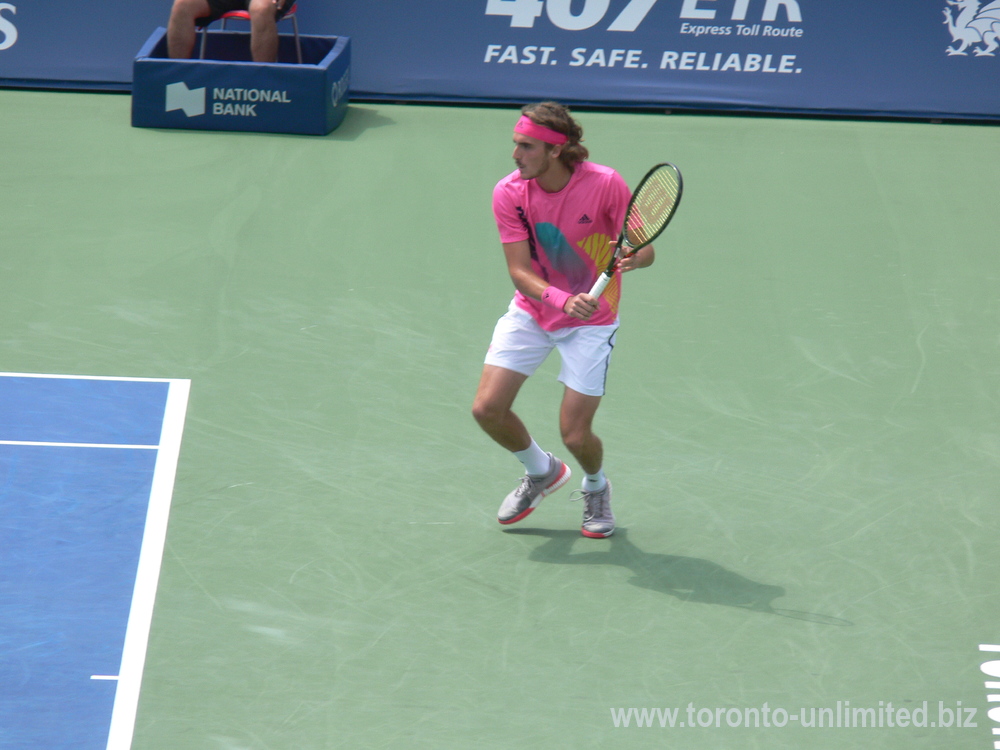 Stefanos Tsitsipas returning backhand to Novak Djokovic on Centre Court August 9, 2018 Rogers Cup Toronto