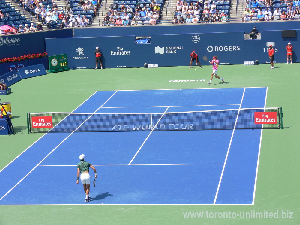 Stefanos Tsitsipas returning serve from Novak Djokovic  on the Centre Court August 9, 2018 Rogers Cup Toronto!