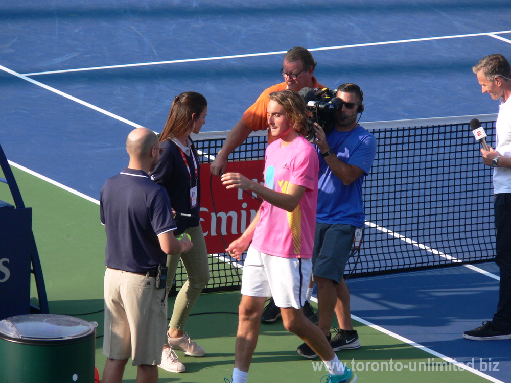 Stefanos Tsitsipas signing the tennis balls for the fans August 11, 2018 Rogers Cup Toronto.