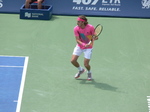 Stefanos Tsitsipas returning backhand to Novak Djokovic on Centre Court August 9, 2018 Rogers Cup Toronto