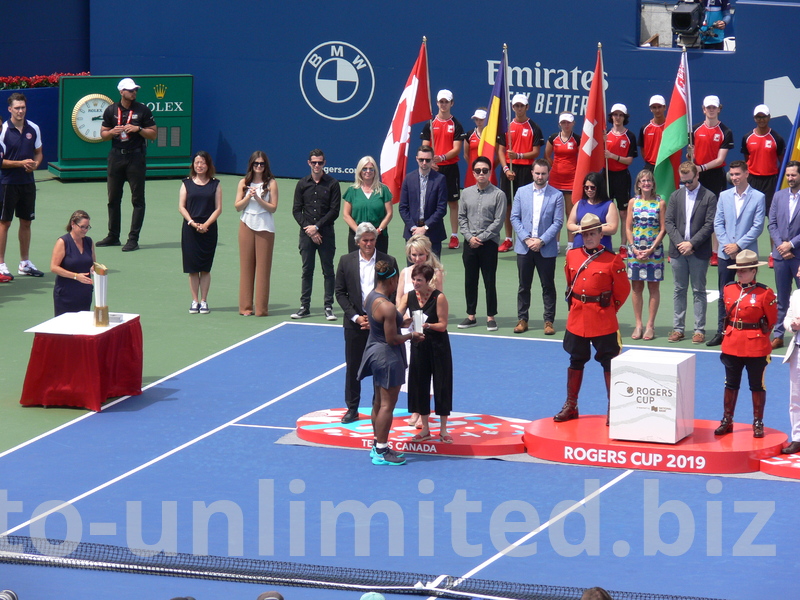 Serena Williams is receiving the runners-up Trophy from Lucie Blanchet of National Bank, August 11, 2019 Rogers Cup