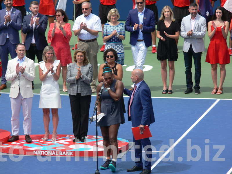 It is tough for Champion as Serena to explain and justify her loss. She is being consoled by Ken Crosina, Rogers Cup Master of Ceremonies