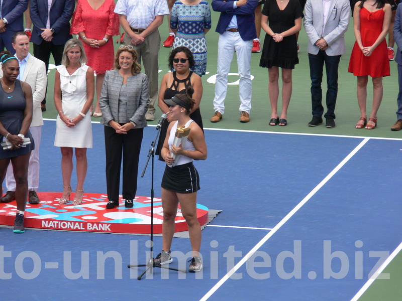 Rogers Cup Champion Bianca Andrescu is in front of microphone speaking to the spectators, August 11, 2019