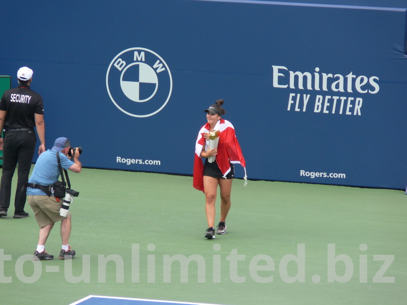 Canadian Champion Bianca Andrescu is wrapped in Canadian flag on Centre Court August 11, 2019 Rogers Cup Toronto