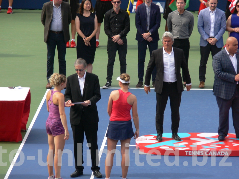 Alan Horn of Rogers Telecommunication is talking to the Doubles Champs Katerina Siniakova and Barbora Krejcikova, August 11, 2019 Rogers cup Toronto