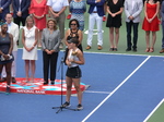 Rogers Cup Champion Bianca Andrescu is in front of microphone speaking to the spectators, August 11, 2019