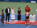 Serena Williams with her Trophy and Binaca Andrescu with her are leaving to meet with members of their support teams, August 11, 2019