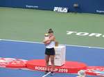 Bianca Andrescu is hugging her Championship Trophy on Centre Court, August 11, 2019 Rogers Cup Toronto 