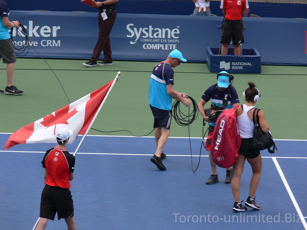 Rising Canadian Star Bianca Andrescu and Canadian Flag, coming to Centre Court to play quarterfinal match August 9, 2019 Rogers Cup Toronto.