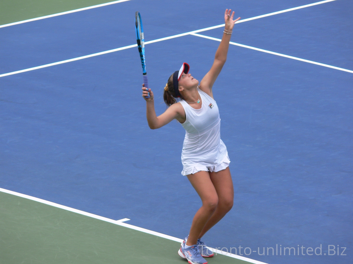 Sofia Kenin US on the Centre Court serving in the quarterfinal match to Elina Svitolina UKR, August 9, 2019 Rogers Cup Toronto