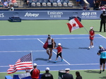 Bianca Andrescu with her headset and Canadian flag behind her coming to Centre Court to play semifinal match, August 9, 2019 Rogers Cup in Toronto