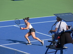 Bianca Andrescu vollying near the net to Kiki Bertens on Centre Court, August 6, 2019 Rogers Cup in Toronto