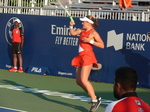Jelena Ostapenko is returning ball on Grandstand Court August 12, 2019 Rogers Cup in Toronto 
