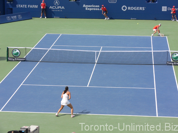 Jelena Jankovic and Justine Henin on the court. Rogers Cup 2007 Toronto!