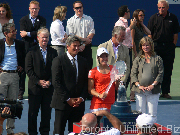 Justine Henin Champion with Karl Hale Tournament Director.