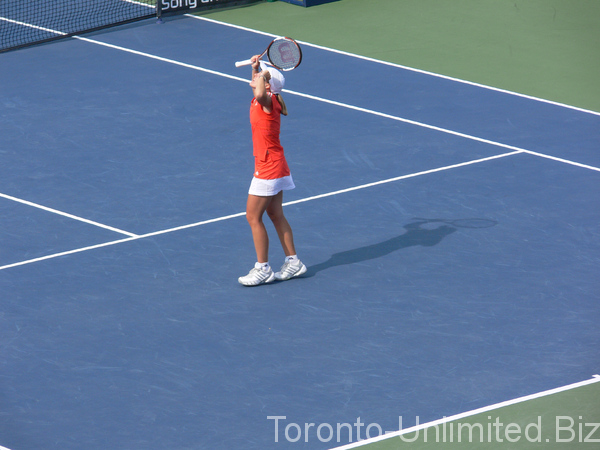 Jubilant Justine Henin Champion after the point.