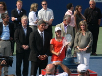 Justine Henin Champion with Karl Hale Tournament Director.