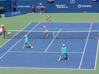 Srebotnick and Sugiyama with Black and Huber on Centre Court.