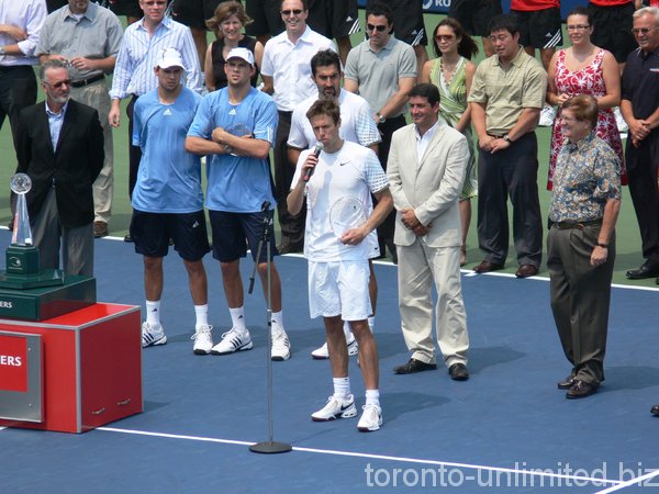 Doubles Champions Nestor and Zimjonic. Nestor in speech.