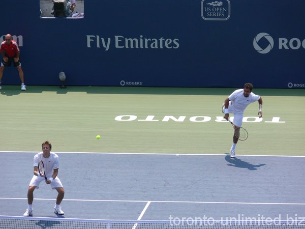 Zimjonic serving and Nestor at the net.