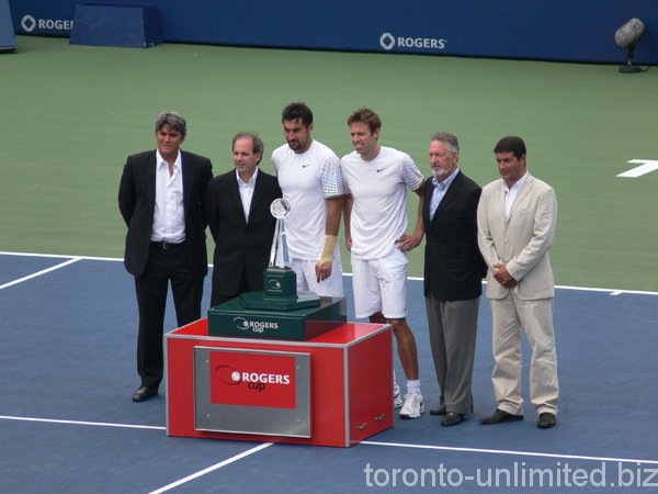 Nestor and Zimjonic receiving award and posing for photos.