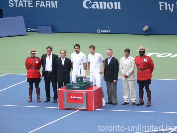 Nestor and Zimjonic, Doubles Champions posing for pictures.